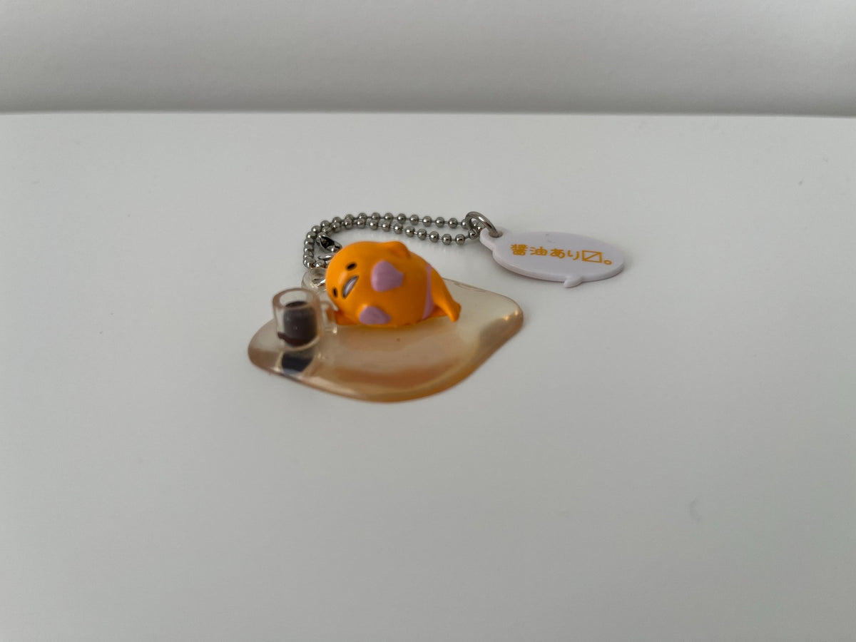 Gudetama Sunbathing Gashapon Keychain by Takara Tomy