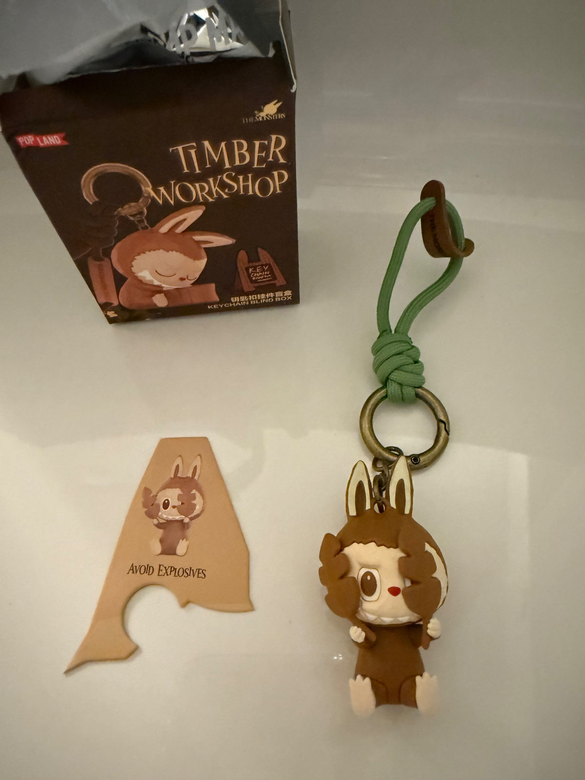 Avoid Explosives - The Monsters Timber Workshop Keychain - Pop Land Pop Mart