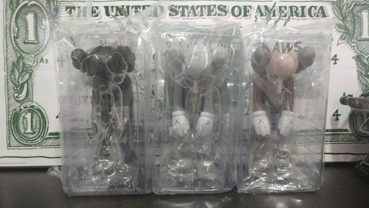 Kaws Small Lie Vinyl Figures - Set of 3 - Black, Grey and Brown